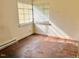 Bedroom with hardwood floors and a window with natural light at 628 Massey Ave, Durham, NC 27701