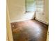 Bedroom featuring hardwood floors, a window, and a radiator at 628 Massey Ave, Durham, NC 27701