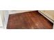A close-up of hardwood bedroom floors, baseboard trim and radiator at 628 Massey Ave, Durham, NC 27701