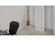 Cozy bedroom with neutral carpet flooring, closet, and interior door at 635 Buckroe Dr, Sanford, NC 27330