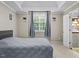 Bedroom with tray ceilings and natural light from the large window at 635 Buckroe Dr, Sanford, NC 27330