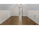 Empty bonus room featuring an attic ceiling, hardwood floor and lots of natural light at 635 Buckroe Dr, Sanford, NC 27330