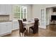 Charming breakfast nook with bright windows, hardwood floors, and comfortable seating at 635 Buckroe Dr, Sanford, NC 27330
