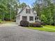 This lovely two-story home has a detached garage, front porch, and manicured yard at 635 Buckroe Dr, Sanford, NC 27330
