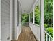 A cozy front porch with white railings offers a relaxing outdoor space at 635 Buckroe Dr, Sanford, NC 27330