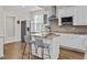 Kitchen showcasing an island with seating, granite countertops, and stainless steel appliances at 635 Buckroe Dr, Sanford, NC 27330