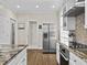 Kitchen featuring stainless steel refrigerator, range, and granite countertops at 635 Buckroe Dr, Sanford, NC 27330