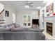 Comfortable living room with fireplace, built-in shelves, and a cozy couch at 635 Buckroe Dr, Sanford, NC 27330