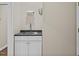 View of a utility sink with cabinet storage and a countertop, practical for various tasks at 635 Buckroe Dr, Sanford, NC 27330