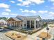 Aerial view of restaurant features outdoor seating and a spacious parking lot at 6618 Perry Creek Rd, Raleigh, NC 27616