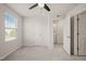 Bedroom featuring neutral carpet, a ceiling fan, and a bright window at 6618 Perry Creek Rd, Raleigh, NC 27616