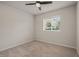 Bright bedroom with a ceiling fan and a large window providing ample natural light at 6618 Perry Creek Rd, Raleigh, NC 27616