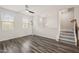 A bright bonus room featuring natural light, a ceiling fan, and modern floor lamp for flexible living at 6618 Perry Creek Rd, Raleigh, NC 27616