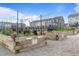 Community garden features raised beds with various plants and neighborhood townhomes at 6618 Perry Creek Rd, Raleigh, NC 27616