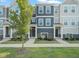 Charming townhouse featuring a well-manicured lawn and beautiful curb appeal at 6618 Perry Creek Rd, Raleigh, NC 27616