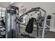 Modern fitness center equipped with weight machines, drinking fountain, and exterior access at 6618 Perry Creek Rd, Raleigh, NC 27616