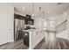 Spacious kitchen with a granite island, stainless steel appliances, and an open layout to living spaces at 6618 Perry Creek Rd, Raleigh, NC 27616