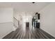 Open concept living room features a kitchen with stainless steel appliances, granite island, and modern finishes at 6618 Perry Creek Rd, Raleigh, NC 27616