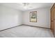Neutral bedroom features carpet, one window, a ceiling fan and a closet at 8509 Ashwood Dr, Raleigh, NC 27603