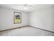 Neutral bedroom features carpet, one window, and a ceiling fan at 8509 Ashwood Dr, Raleigh, NC 27603
