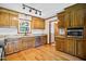 Spacious kitchen features wood cabinetry, granite countertops, stainless steel appliances, and hardwood floors at 8509 Ashwood Dr, Raleigh, NC 27603