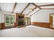 Sunlit living room with cozy fireplace and access to the backyard at 8509 Ashwood Dr, Raleigh, NC 27603
