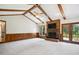 Bright living room features a brick fireplace and access to the outdoor deck at 8509 Ashwood Dr, Raleigh, NC 27603