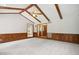 Open living area showcasing hardwood paneling and beamed ceilings at 8509 Ashwood Dr, Raleigh, NC 27603