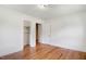 Bedroom featuring hardwood floors, closet, and white walls at 905 S 1St St, Smithfield, NC 27577