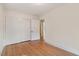 Bedroom featuring hardwood floors, a closet, and bright natural light at 905 S 1St St, Smithfield, NC 27577