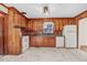 Nostalgic kitchen with wooden cabinets, retro appliances, and durable flooring at 905 S 1St St, Smithfield, NC 27577