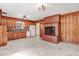 Kitchen with brick fireplace, retro appliances, and ample cabinet space at 905 S 1St St, Smithfield, NC 27577