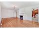 Open living room showcasing hardwood floors and a cozy fireplace, perfect for gatherings at 905 S 1St St, Smithfield, NC 27577