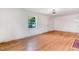 Sunlit living room featuring hardwood floors and neutral walls, ideal for versatile decorating at 905 S 1St St, Smithfield, NC 27577