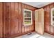 Room with wood paneled walls, a closet, and a window at 905 S 1St St, Smithfield, NC 27577