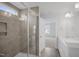 Bright bathroom featuring a glass-enclosed shower and a double vanity with white cabinets at 91 Merle Way Way, Wendell, NC 27591