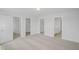 Spacious carpeted bedroom with multiple entryways to closets and an attached bathroom at 91 Merle Way Way, Wendell, NC 27591