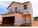 Unfinished home exterior showcasing new construction with large windows and a covered garage at 970 Bombardier Aly, Spring Hope, NC 27882