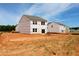Home exterior showcasing new construction with large sliding glass doors in an open space at 970 Bombardier Aly, Spring Hope, NC 27882