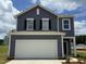 Charming two-story home features a two-car garage and classic architectural details at 970 Bombardier Aly, Spring Hope, NC 27882
