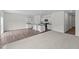 Open-concept living area showcasing a kitchen with an island, seamless flow, and comfortable flooring at 970 Bombardier Aly, Spring Hope, NC 27882