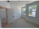 Bright, carpeted bedroom with two windows for natural light at 1002 Regalia Rd # 2, Durham, NC 27713