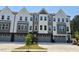 Attractive townhouse exteriors feature varied designs, colors, and attached garages at 1002 Regalia Rd # 2, Durham, NC 27713