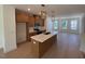 Gourmet kitchen features an island, modern appliances, and stylish pendant lighting at 1002 Regalia Rd # 2, Durham, NC 27713