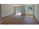 Bright, open-concept living area with hardwood floors and sliding door to deck at 1002 Regalia Rd # 2, Durham, NC 27713