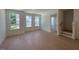 Open-concept living space with abundant natural light and hardwood floors at 1002 Regalia Rd # 2, Durham, NC 27713