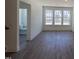 Open living room with luxury vinyl plank flooring and natural light at 1004 Regalia Rd # 3, Durham, NC 27713