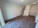 Open-concept living area with stairs to the second level at 1004 Regalia Rd # 3, Durham, NC 27713