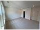 Empty bedroom with carpeted flooring, three-panel window and recessed lighting at 1006 Regalia Rd # 4, Durham, NC 27713