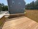 Wooden deck with modern horizontal wood privacy screen in the backyard of a townhome at 1006 Regalia Rd # 4, Durham, NC 27713